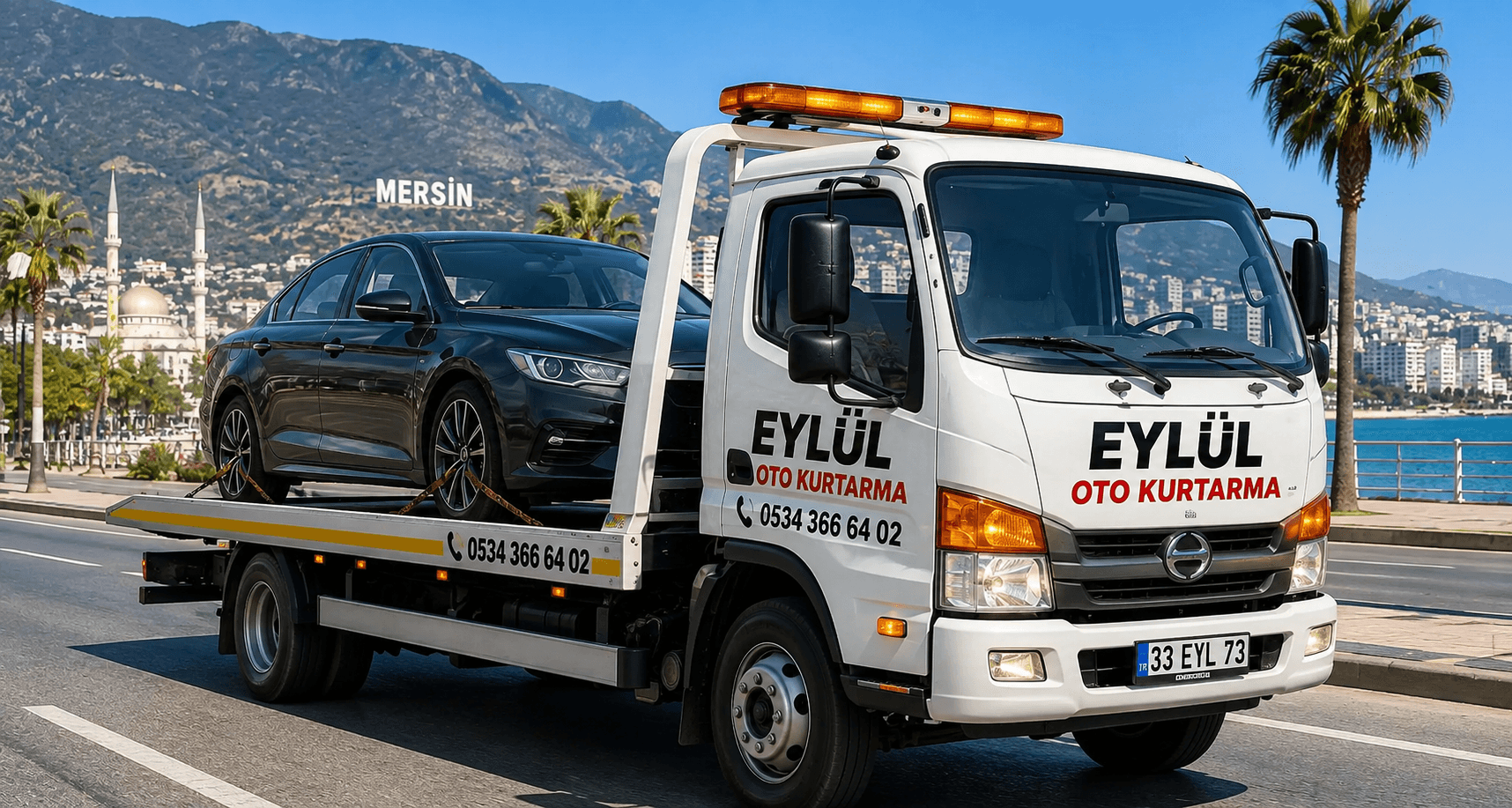 Eylül Oto Kurtarma çekicisi Mersin sahil yolunda araç taşırken